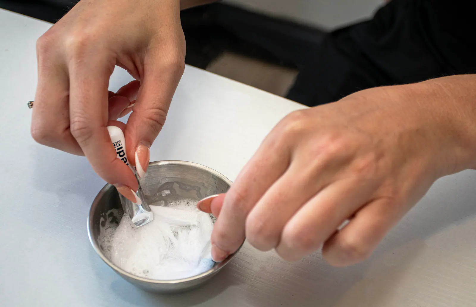 Facial treatment product being prepared in the clinic.