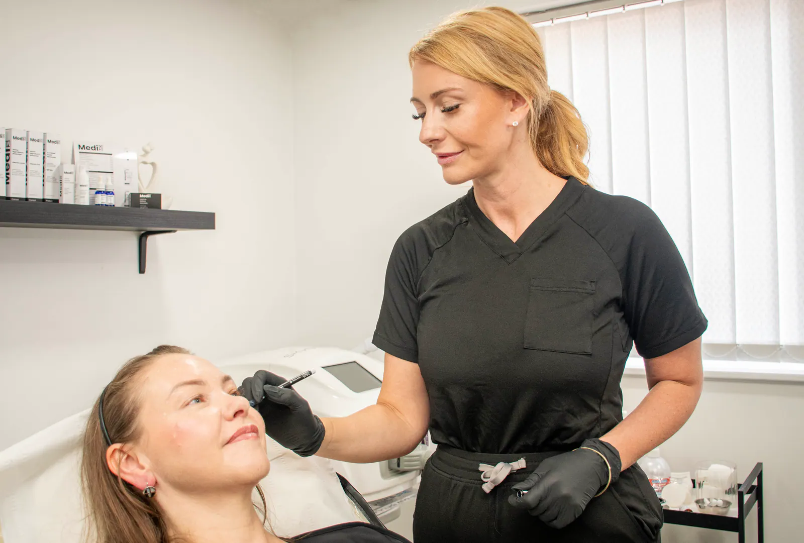 Kelly supporting a client during a clinic appointment.
